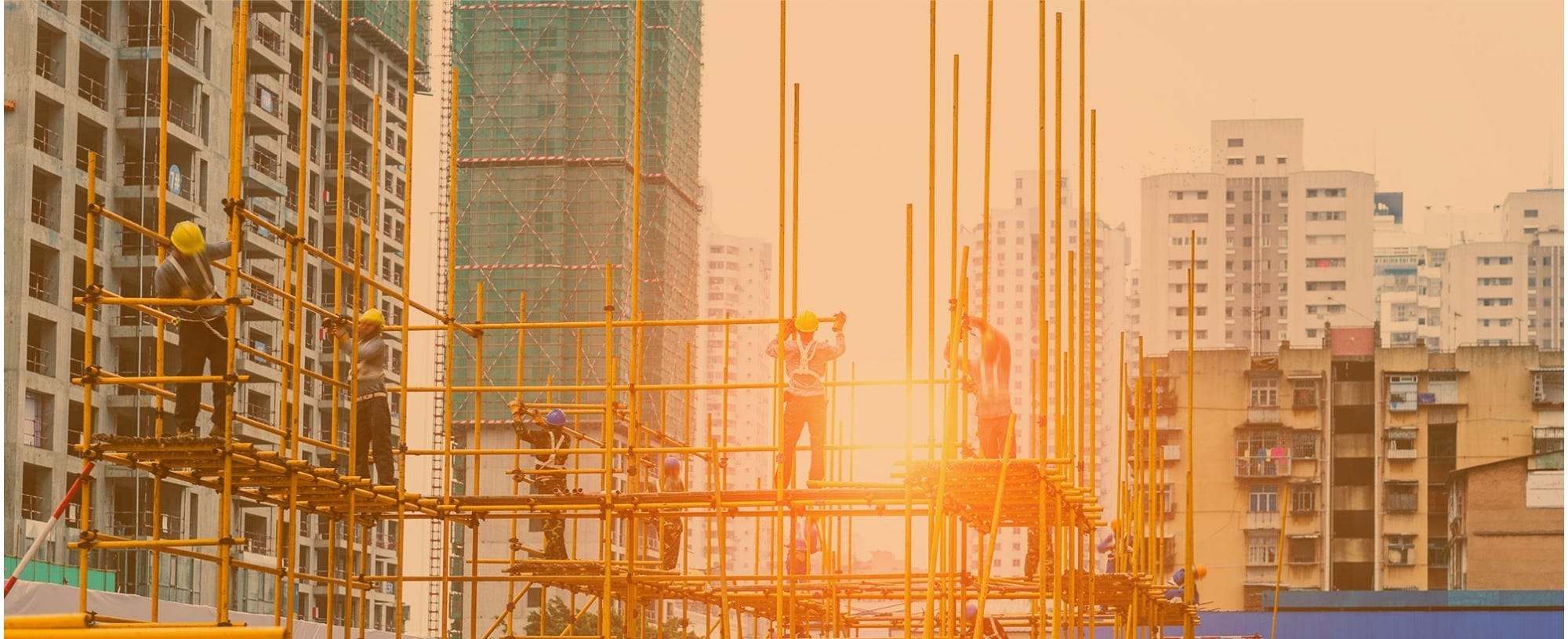 Workers constructing Scaffolding in a city
