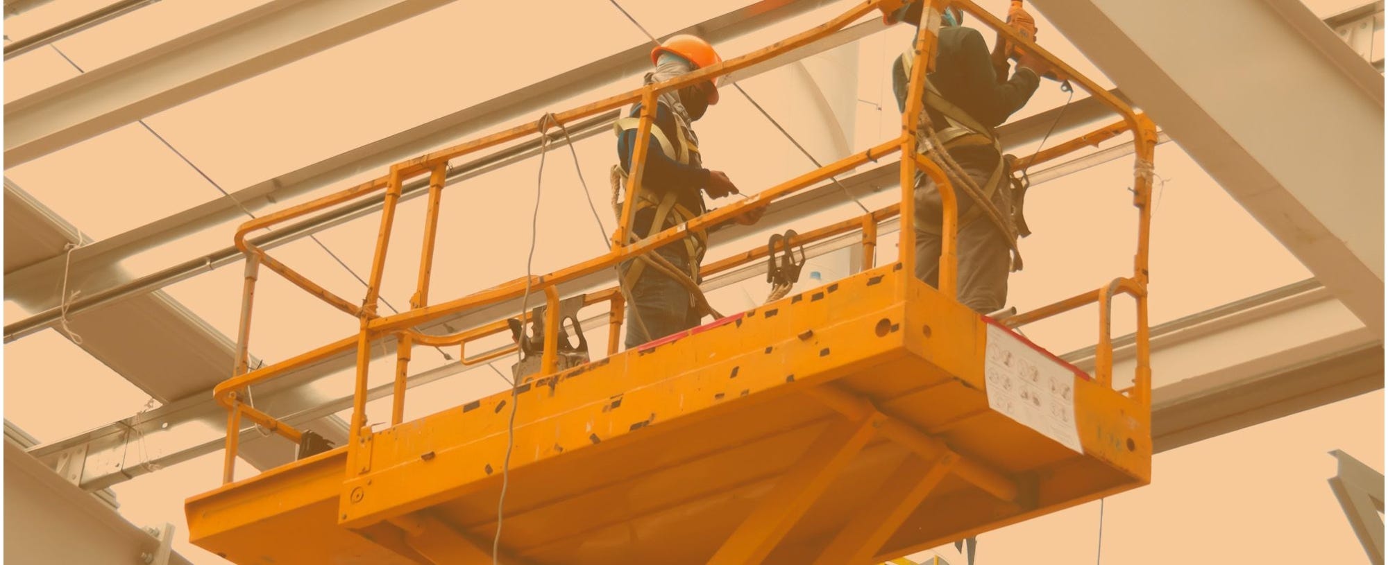 Two workers on a scissor lift 