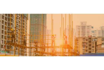 Workers constructing Scaffolding in a city